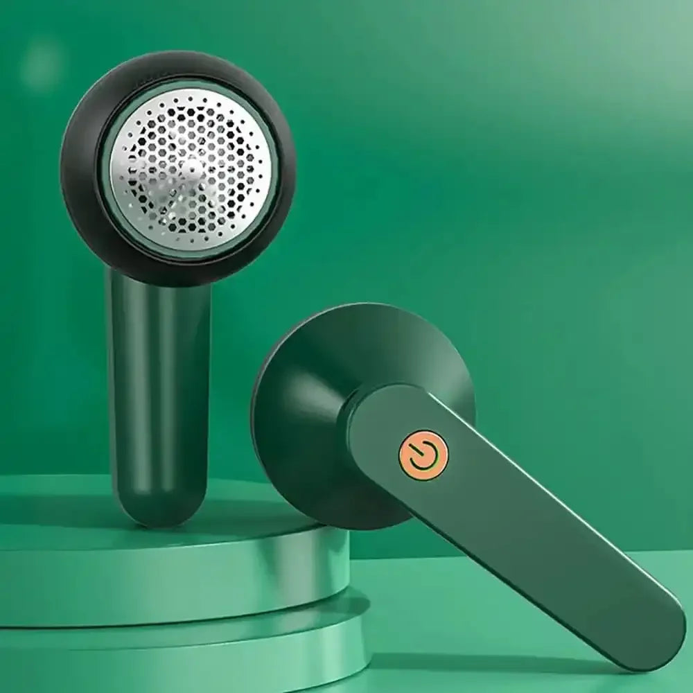 Green fabric lint remover with metal blade head and power button on green background