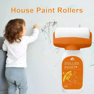Child drawing on wall next to orange house paint roller, home cleaning product concept