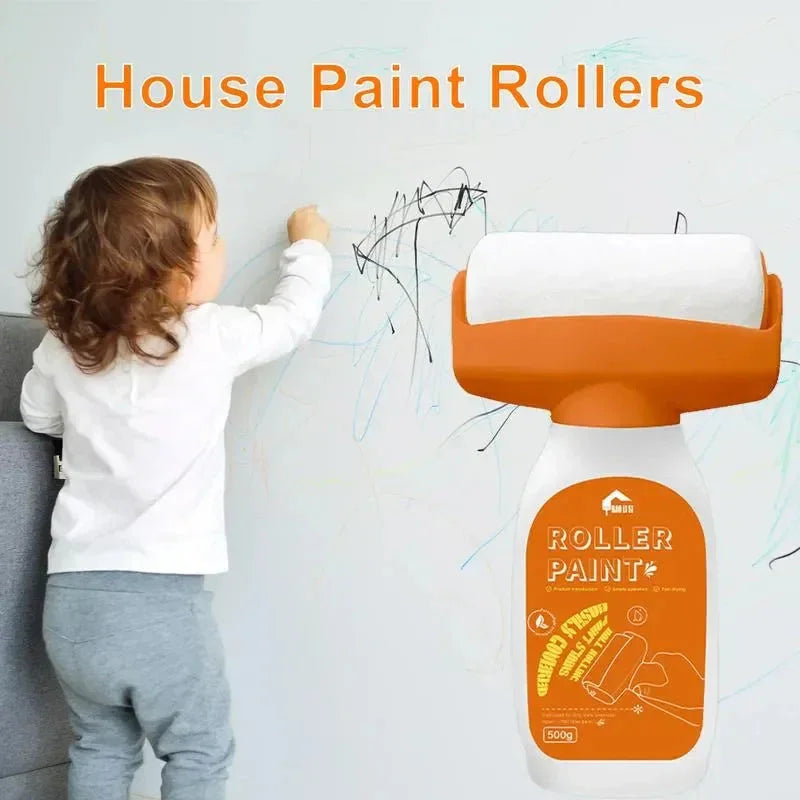 Child drawing on wall next to orange house paint roller, home cleaning product concept