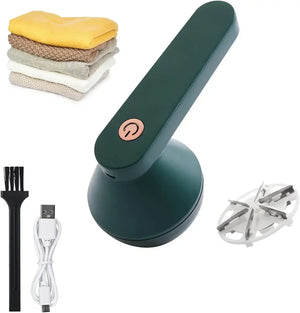 Electric fabric shaver with USB cable, cleaning brush, extra blade, and folded clothes.