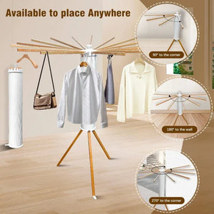 Foldable clothes drying rack with wooden arms and tripod base, shown in modern room.