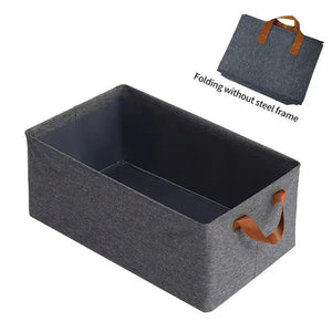 Collapsible grey fabric storage box with brown handles, folding without steel frame