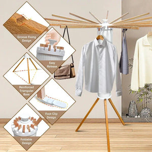 Foldable wooden clothes drying rack with groove fixing, foot clip, and reinforced base, holding shirts indoors.