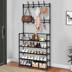 Black metal entryway shoe rack with hooks for bags, hats, and coats, holding shoes and boxes