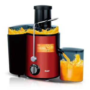 Red RAF electric juicer making fresh orange juice, splashing juice and fruit, kitchen appliance