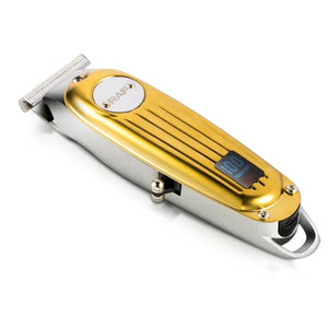 Gold and silver electric hair clipper with digital display on white background