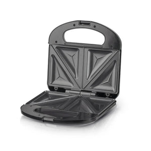 Open non-stick sandwich maker with triangular grill plates on white background