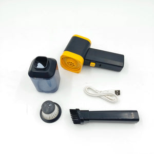 Handheld mini vacuum cleaner with attachments, USB cable, and dust container on white background