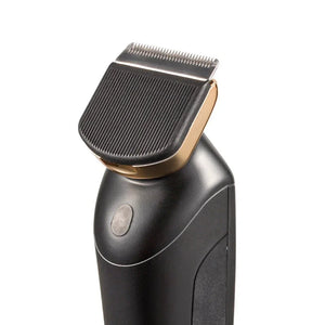 Black and gold electric hair clipper with textured grip on white background