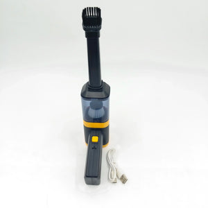 Portable handheld vacuum cleaner with brush nozzle and USB charging cable on white background