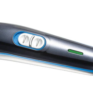 Close-up of a silver hair straightener with control buttons and a green indicator light