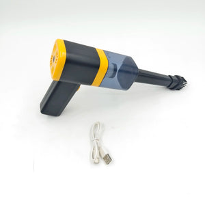 Handheld mini vacuum cleaner with brush nozzle and USB charging cable on white background