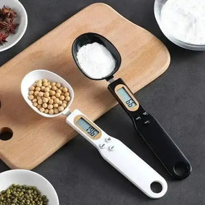 Digital measuring spoon scales with ingredients on cutting board in kitchen setting