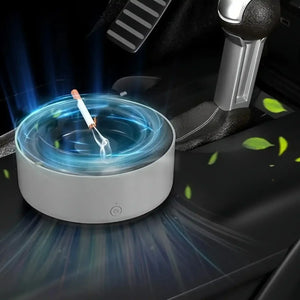 Car air purifier ashtray with cigarette on car console, blue light and green leaves effect