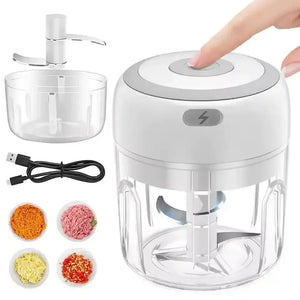 Electric mini food chopper with USB cable, blades, and assorted chopped vegetables.