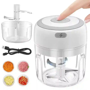 Electric mini food chopper with USB cable, blades, and assorted chopped vegetables.