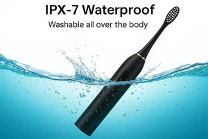 Black electric toothbrush submerged in water, demonstrating IPX-7 waterproof feature
