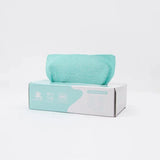 Aqua microfiber cleaning cloth on a white and teal removable rag box, isolated background